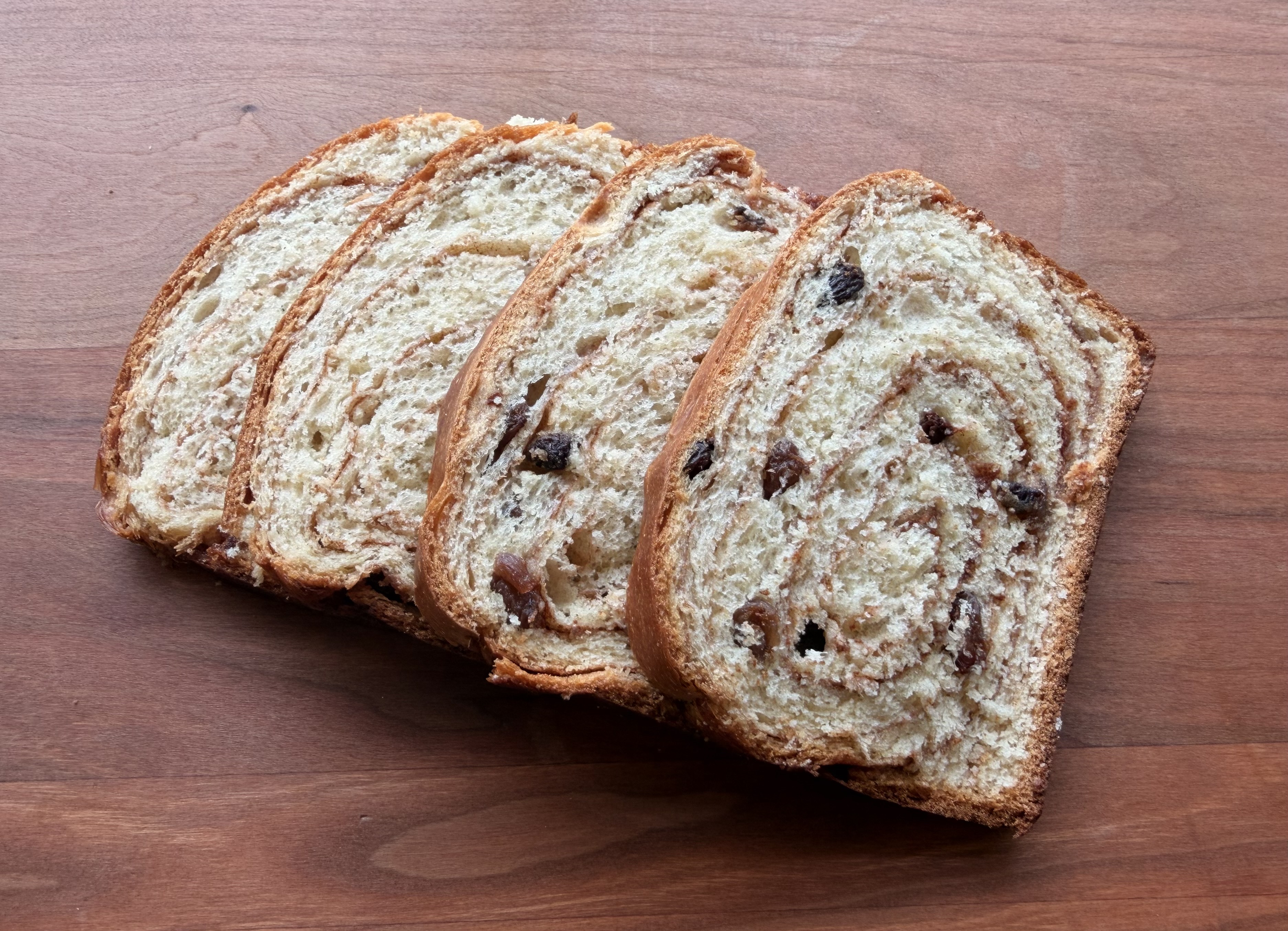 A sliced loaf of cinnamon raisin bread